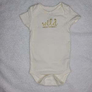 White onesie with gold lettering